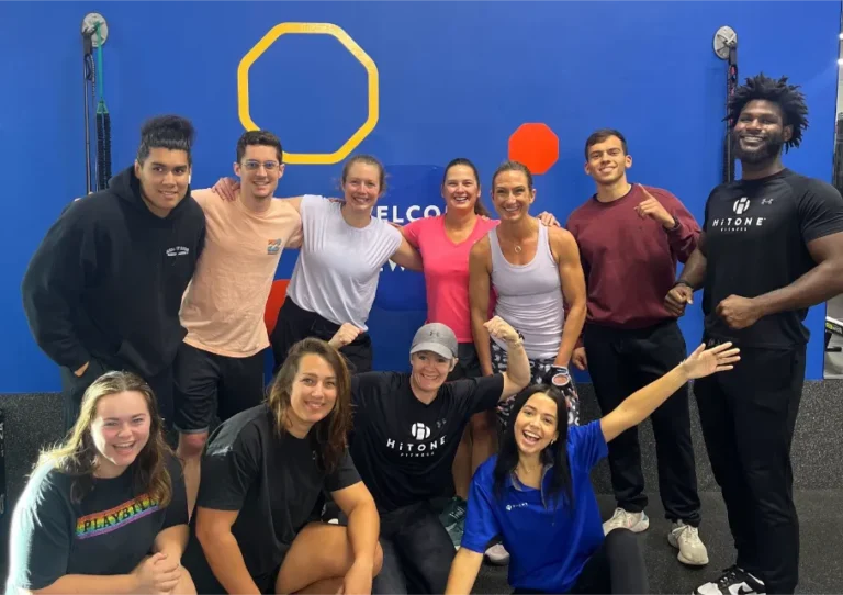 A group of gym goers posing for a photo.