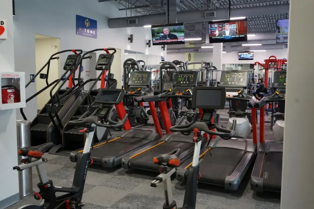 Set of treadmills with red accents.