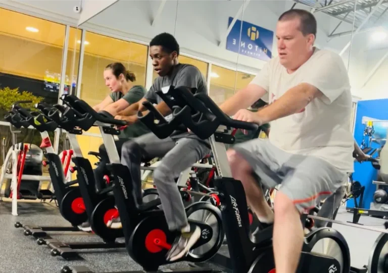 3 People ridding stationary bikes.