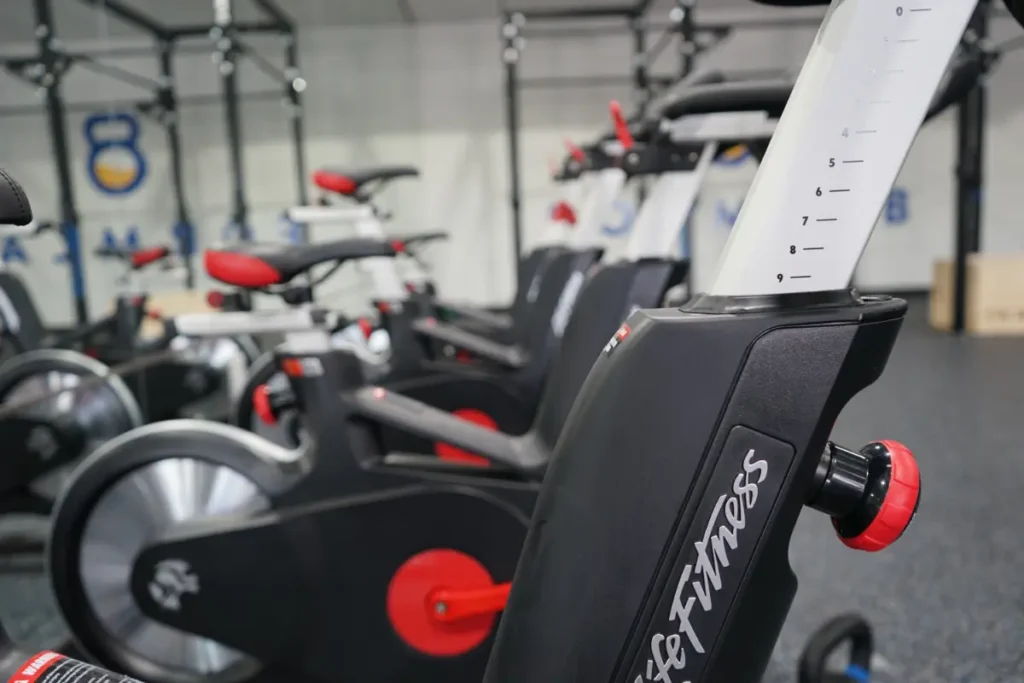 A close up of stationary bikes.