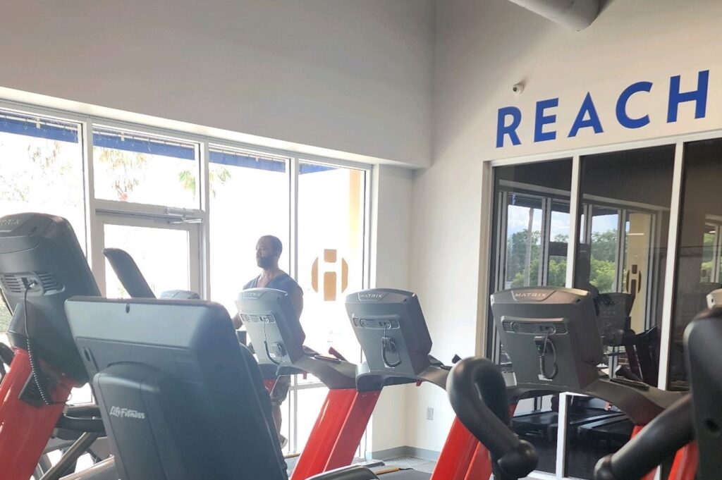 Man on treadmill in a gym.