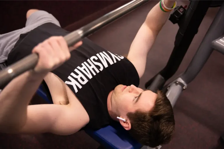 Young man on bench press.