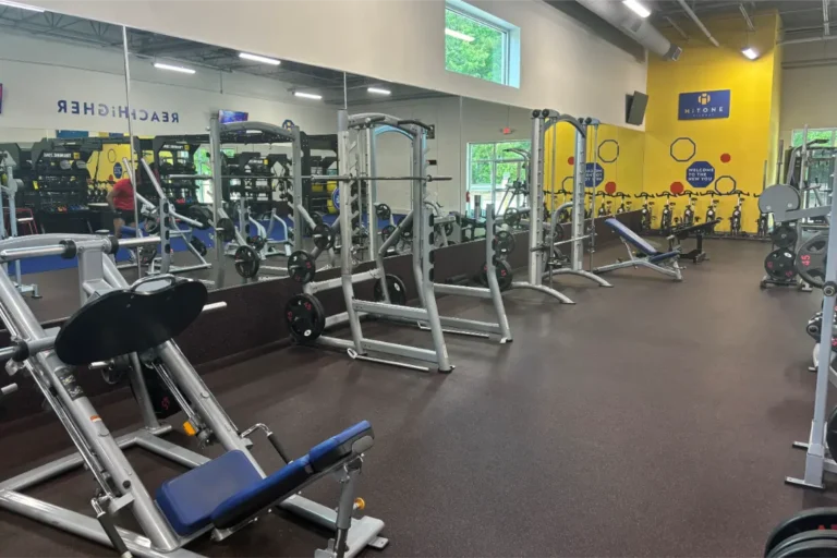 Hack smith machine, smith machine and adjustable benches at a gym.