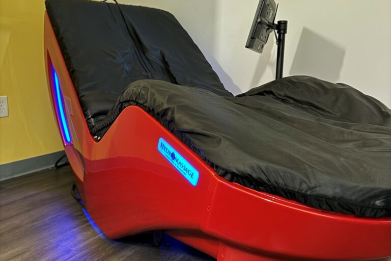 A hydromassage machine in a room.