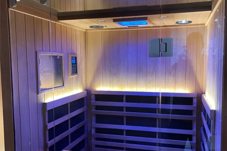 Light therapy sauna with closed doors viewed outside of it.