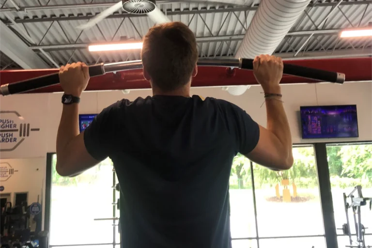 A man doing the pull-up exercise.