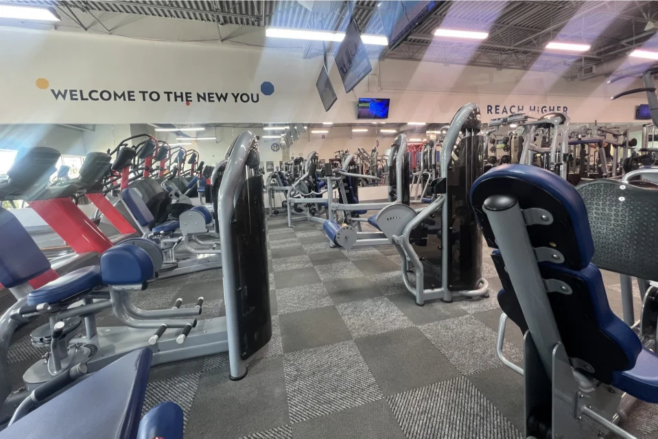 Various fitness machines at a gym.