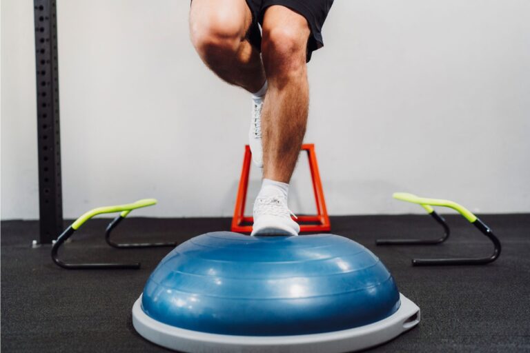 A mans leg on the BOSU ball.